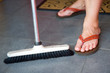 housewife with broom