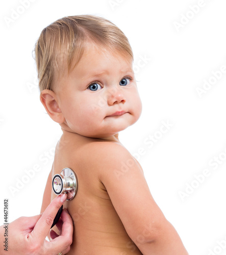 Photo: Pediatric doctor examining little baby girl with stethoscope iso Pediatric doctor examining little baby girl with stethoscope iso