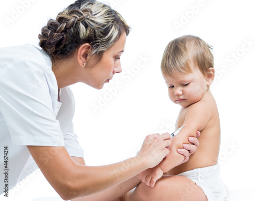Photo: doctor vaccinating baby isplated on a white background doctor vaccinating baby isplated on a white background