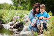 Mother and Son Playing Near Lake