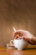 Hand holding a cigarette
