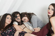 Portrait of young man resting with female friends