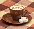 The cup of coffee on the plate