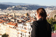 Woman looking down at the City of Nice