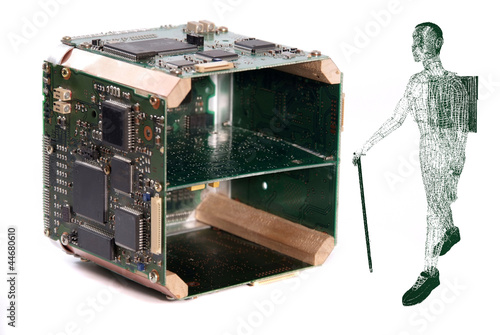 Illustration: Man carrying a laptop past computer components Man carrying a laptop past computer components