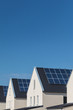 Row of new houses with solar panels on the roofs
