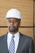 Portrait of an African American male engineer with wooden planks in background