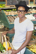 Portrait of an African American man with vegetable basket at supermarket