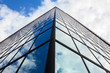 Glass building reflecting the sky
