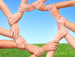 Foto: Ring of hands teamwork showing your product in nature Ring of hands teamwork showing your product in nature