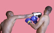 Photo: African American boxer punching opponent over pink background African American boxer punching opponent over pink background