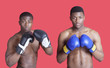 Photo: Portrait of two African American boxers wearing gloves over red background Portrait of two African American boxers wearing gloves over red background