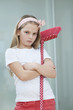 Portrait of an angry girl with broom