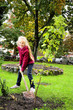 Young girl planting tree