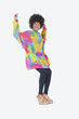 Photo: Full length portrait of happy African American woman in dashiki dancing over gray background Full length portrait of happy African American woman in dashiki dancing over gray background