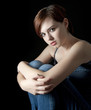 Photo: young woman and dark background young woman and dark background