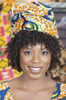 Foto: Close-up portrait of an African American woman wearing traditional head wrap Close-up portrait of an African American woman wearing traditional head wrap