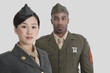 Portrait of young US military officers in uniform over gray background