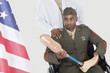Foto: Doctor with disabled military officer holding artificial limb as he looks at American flag Doctor with disabled military officer holding artificial limb as he looks at American flag