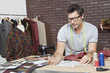Mature male fashion designer working in design studio