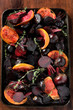 Roasting tray of baby beets and citrus slices
