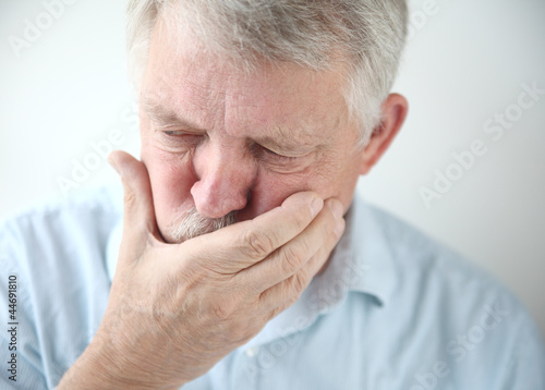 Photo: older man feels nausea older man feels nausea