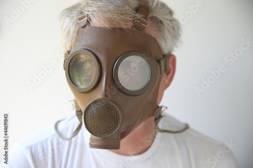 Photo: old gas mask worn by senior man old gas mask worn by senior man