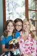 Portrait of mother and daughters smiling