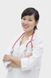 Photo: Portrait of an Asian female veterinarian standing arms crossed over gray background Portrait of an Asian female veterinarian standing arms crossed over gray background