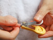 trimming fingernail for a newborn baby