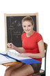 Photo: Caucasian college student woman studying math exam Caucasian college student woman studying math exam