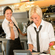 Cafe waitress cashes in order bill register