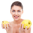 young woman holding an apple and a pear