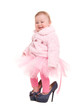  baby in the shoes of adults, and a pink tutu