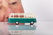 Man looks on model buses
