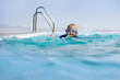 Boy Swimming In an Infinity Pool