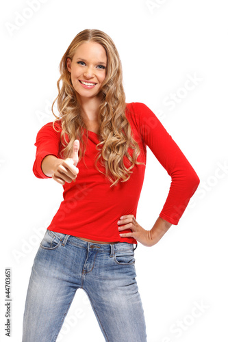 Photo: portrait of a happy young woman with thumb's up sign portrait of a happy young woman with thumb's up sign