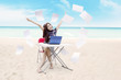 Young asian businesswoman expressing her success at beach