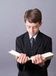 Boy reading from the Bible
