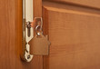 A key in a lock with house icon on it