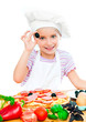 Photo: little girl preparing a pizza little girl preparing a pizza