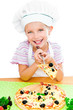 Photo: little girl preparing a pizza little girl preparing a pizza