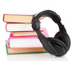 Headphones on books isolated on white