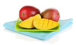 Ripe appetizing mango on green plate isolated on white