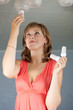 Girl changes  bulb