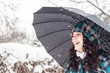 Photo: Girl with umbrella in the snow Girl with umbrella in the snow