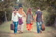 Hippie Group Walking on a Countryside Road