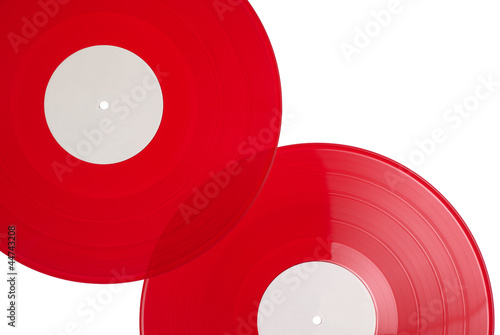 Photo: Red vinyl records isolated on white Red vinyl records isolated on white