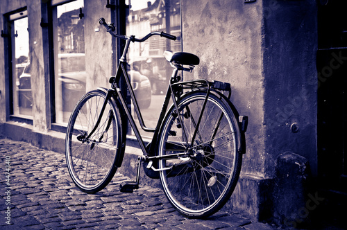 Photo: Classic vintage retro city bicycle in Copenhagen, Denmark Classic vintage retro city bicycle in Copenhagen, Denmark