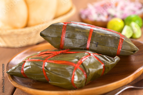 Photo: Peruvian tamales wrapped in banana leaves Peruvian tamales wrapped in banana leaves